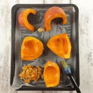 Pumpkin pieces on a roasting tin