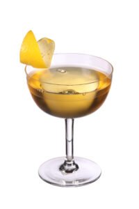 Brainstorm cocktail in a coupe glass with a lemon garnish