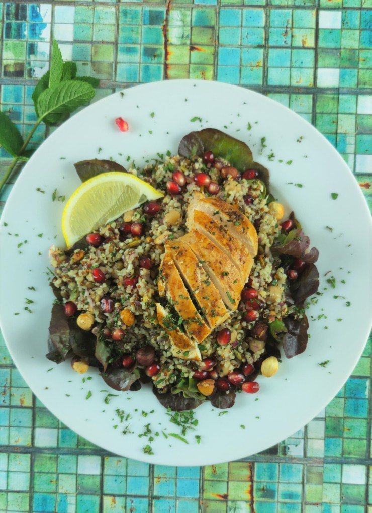 Colorful super grain salad with quinoa and barley, fresh vegetables, and herbs providing slow-burning complex carbohydrates for all-day vitality
