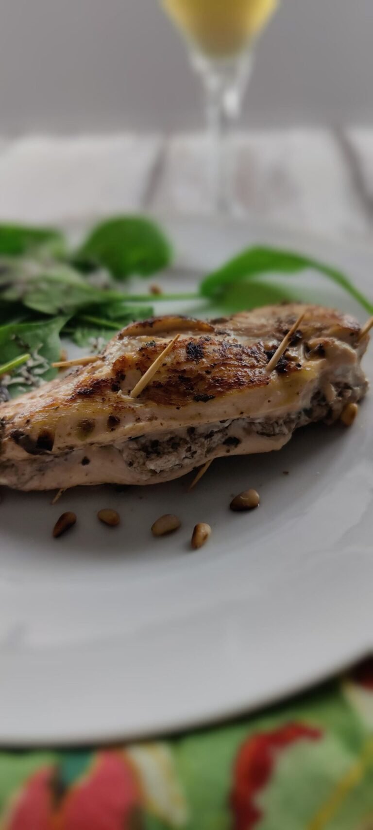 chicken breast stuffed with tapenade and goat cheese on a plate