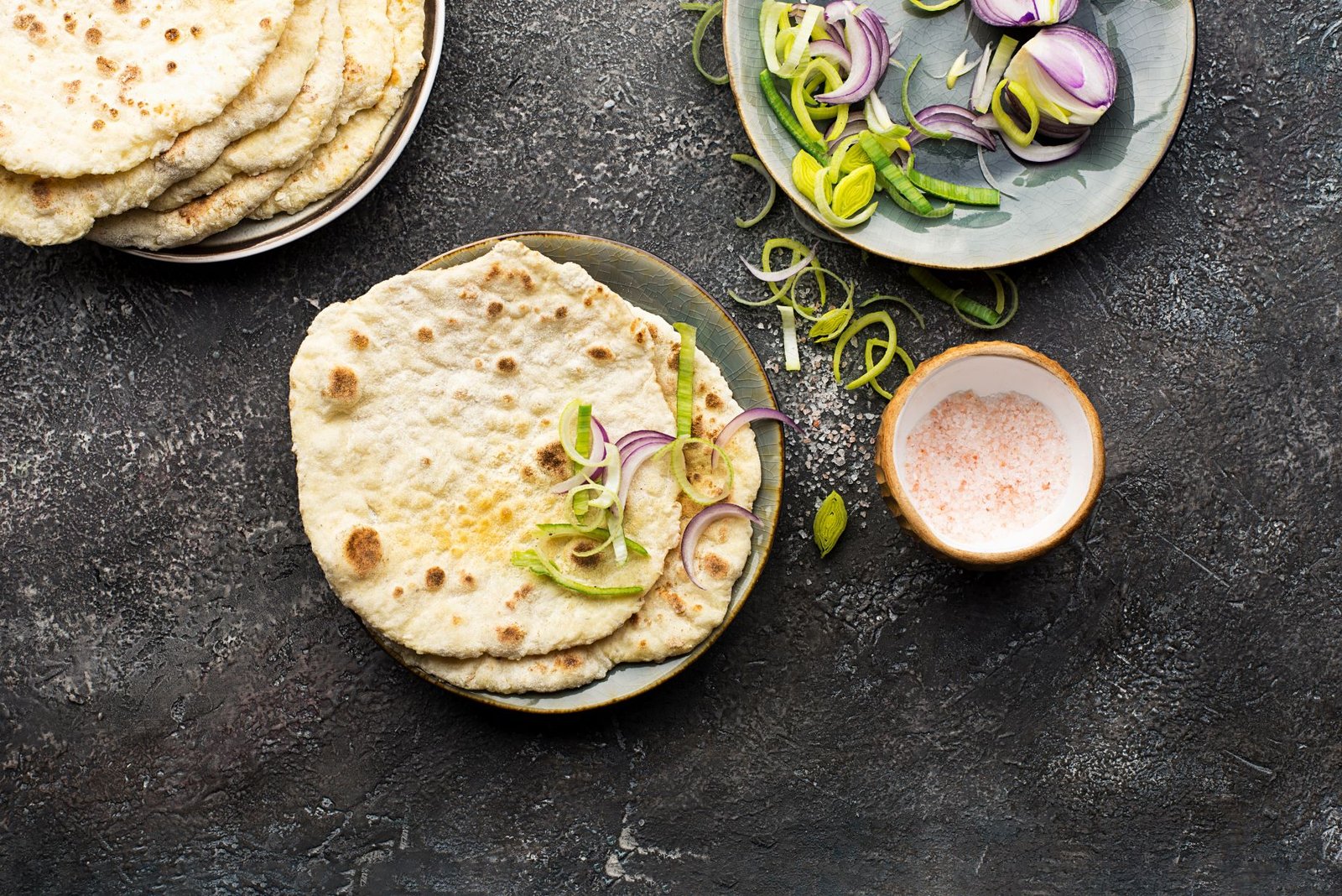 flatbreads on plates with garnish