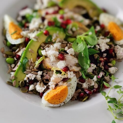 Super Protein chicken, with grains, eggs, pomegranate seeds, avocado Salad