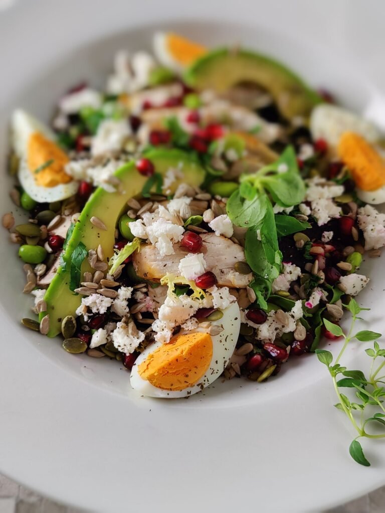 Super Protein chicken, with grains, eggs, pomegranate seeds, avocado Salad