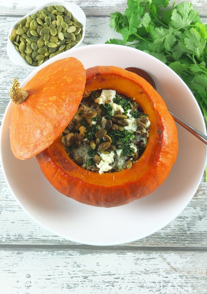 Roasted vegetarian stuffed pumpkin with seeds for a high-zinc eye health meal.