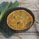 Golden pumpkin and gorgonzola tart in flaky pastry, combining beta-carotene with protein for balanced energy release