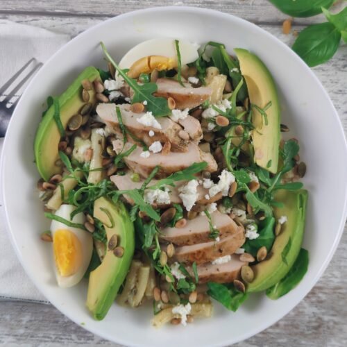 Mediterranean Chicken Pesto Pasta Salad with fresh basil and heart-protective monounsaturated fats.