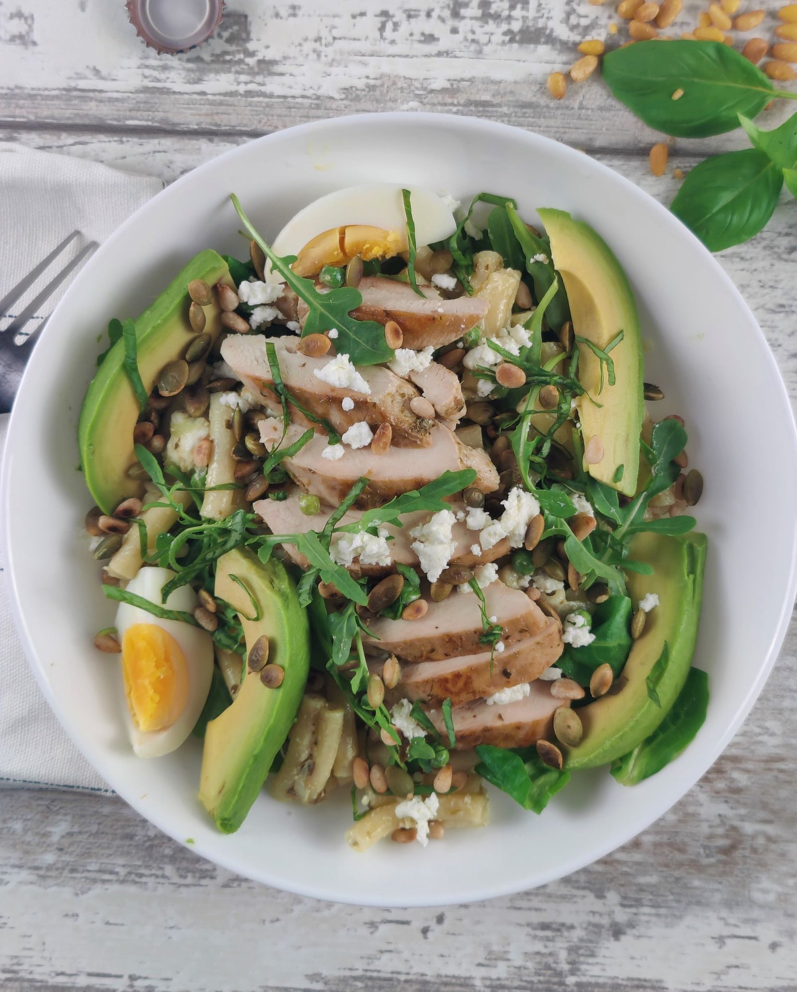 Mediterranean Chicken Pesto Pasta Salad with fresh basil and heart-protective monounsaturated fats.