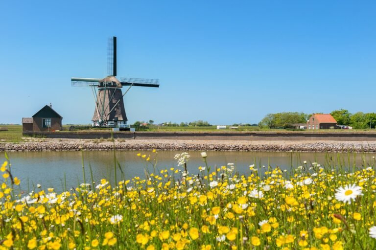 windmill along a canal in Texel Holland for TRAVEL