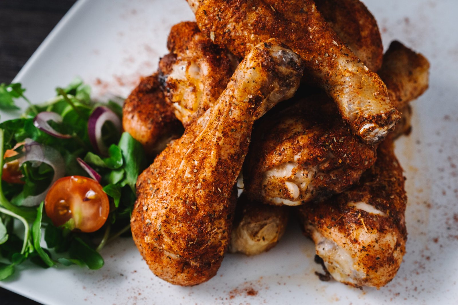 cooked chicken legs with a dry rub mix