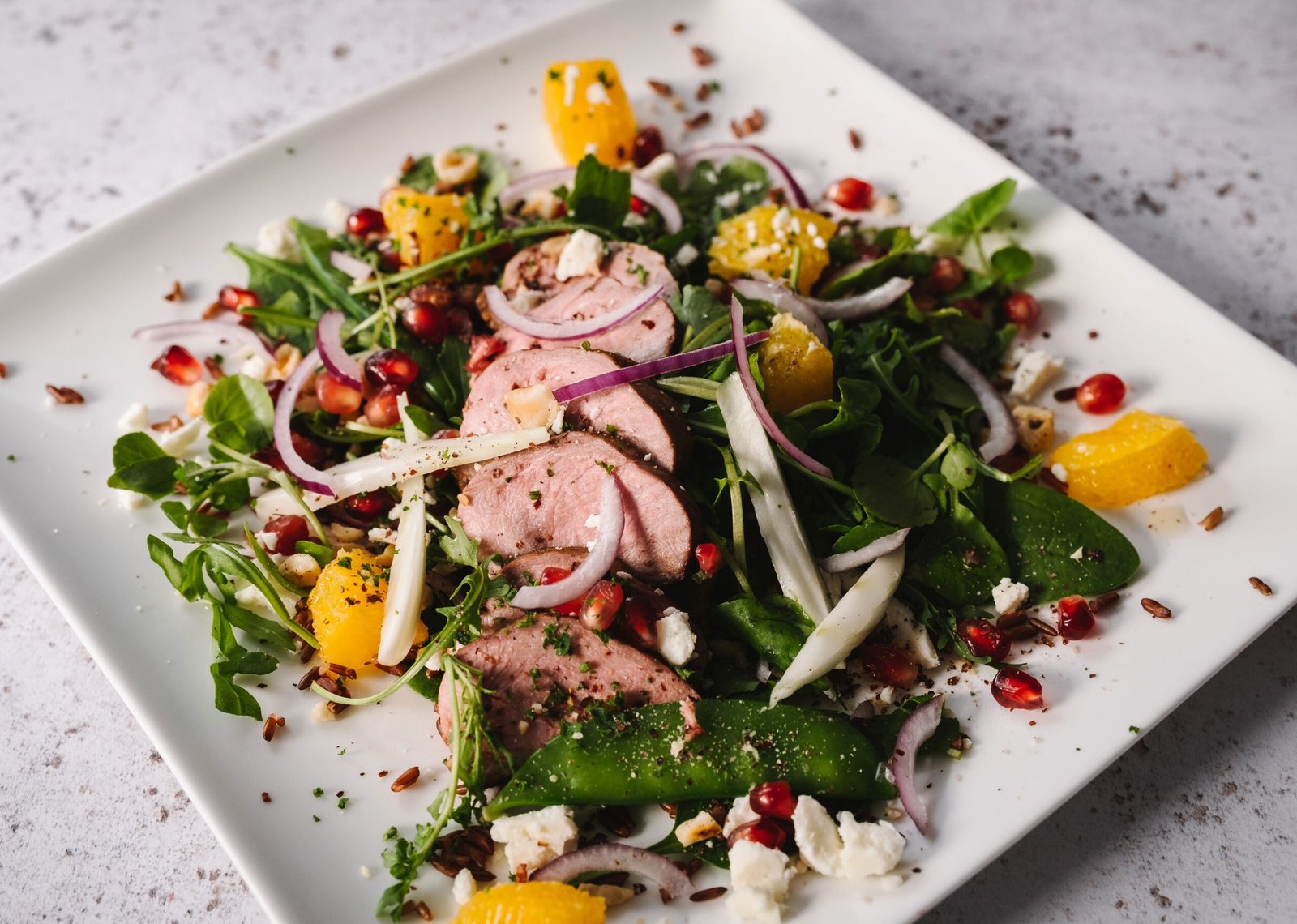 duck a l'orange salad with fennel, mange tout, red rice, quinoa and hazelnuts