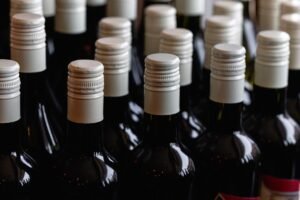 wine storage with bottles standing up with screw tops