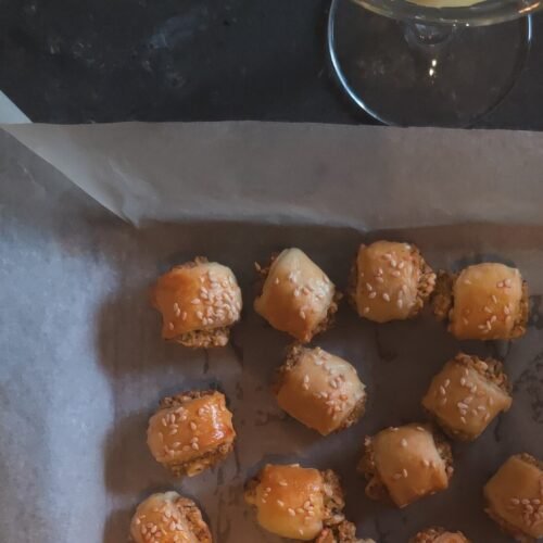 cheese and olive rolls with a martini