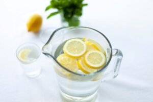 water in pitcher with lemon slices
