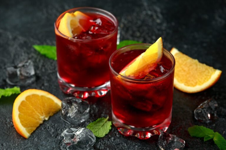 Classic Old Fashioned Negroni cocktail on rustic stone background. *
