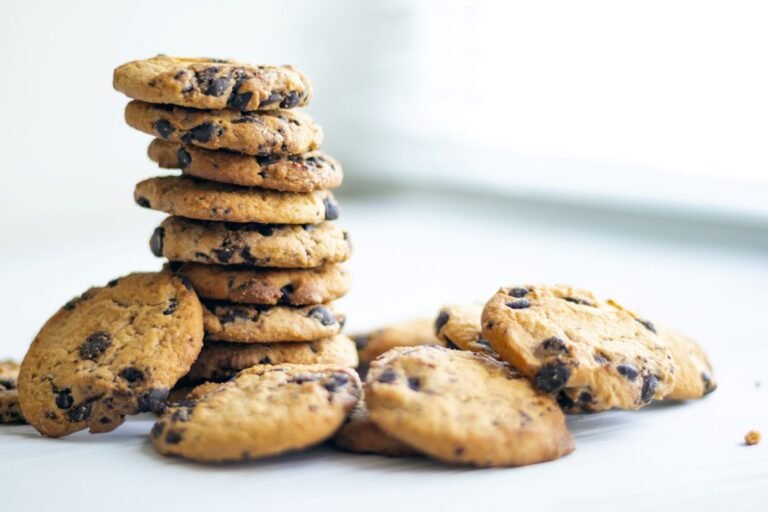 stack of chocolate chip cookies on a white plate
