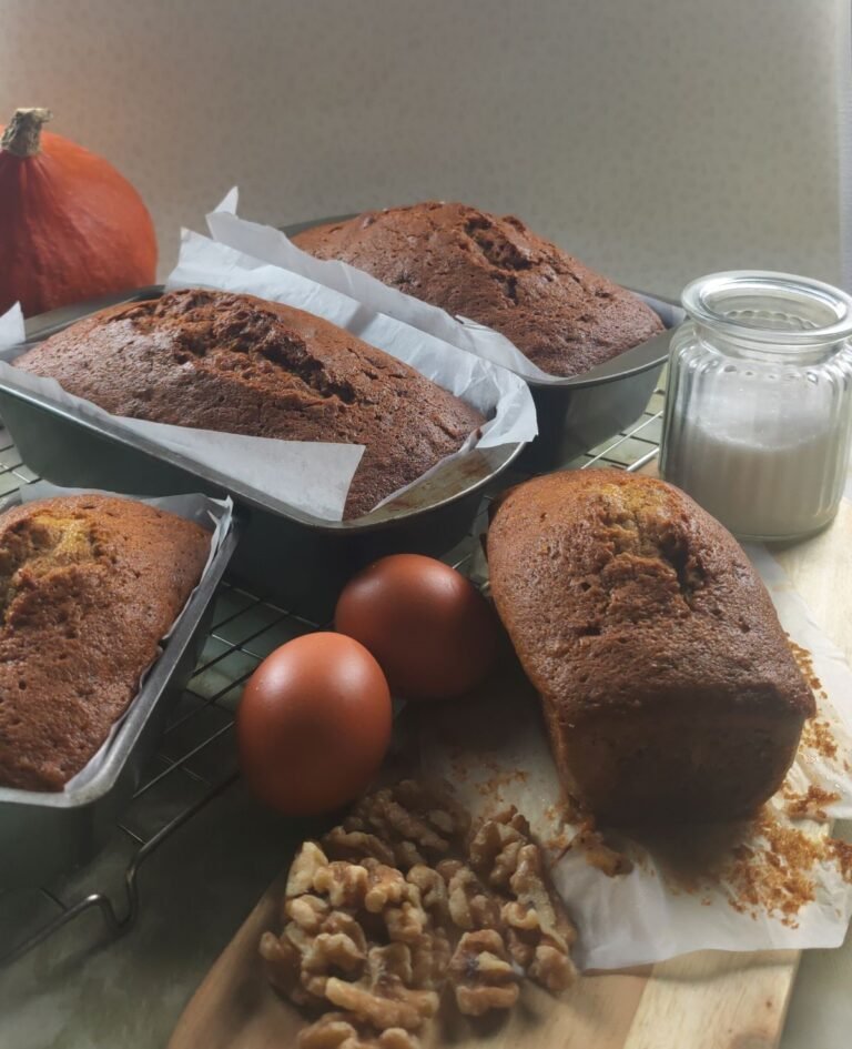 Loaves of Pumpkin Pie Loaf Cake straight from the oven on a cooling rack