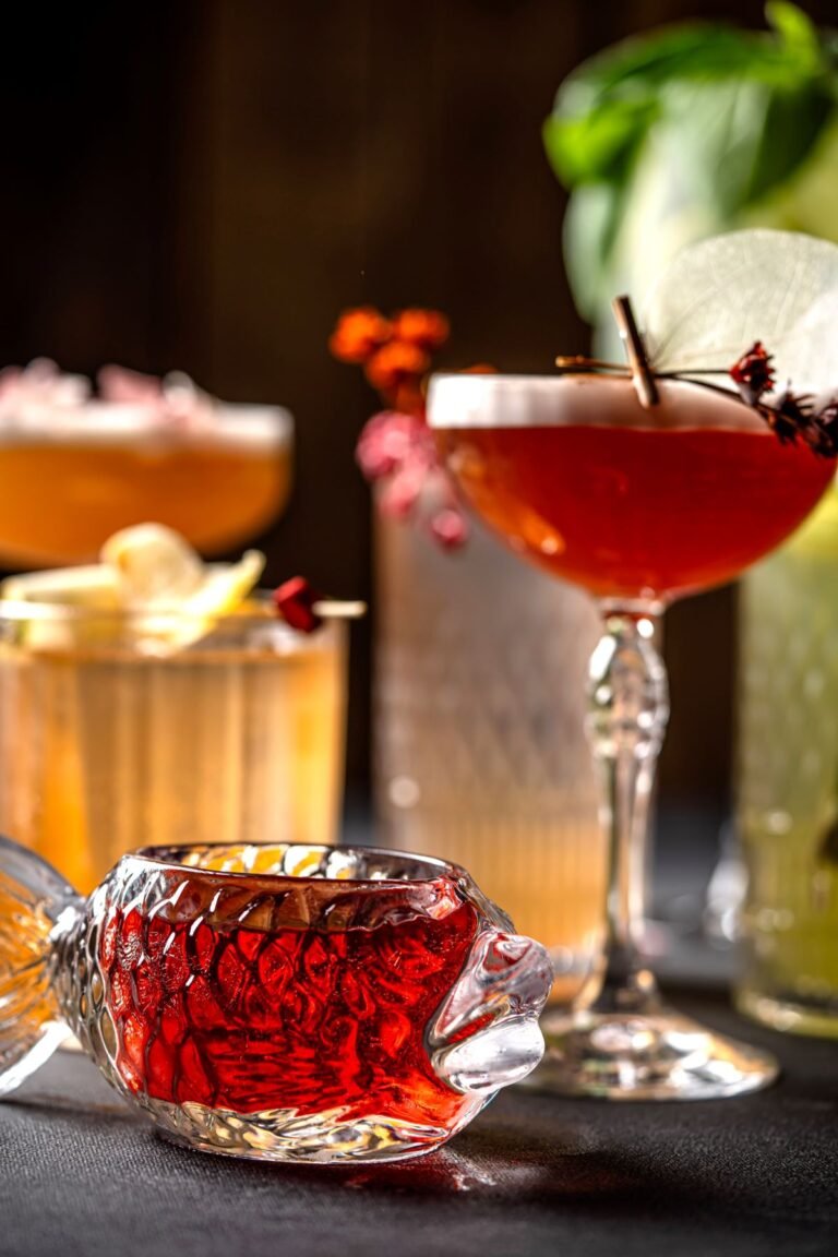 colourful cocktails on a dark background with festive glassware