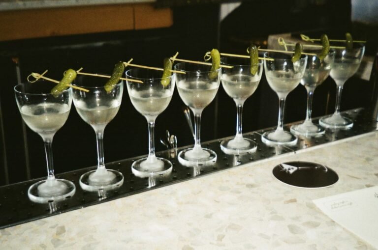 best gin drinks on a bar garnished with piclke